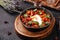 Shakshuka eggs with tomatoes in an cast-iron pan