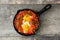 Shakshuka in iron frying pan. Typical food in Israel.