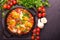 Shakshuka. Traditional Israeli cuisine. Fried eggs with vegetables