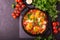 Shakshuka. Traditional Israeli cuisine. Fried eggs with vegetables