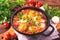 Shakshuka. Traditional Israeli cuisine. Fried eggs with vegetables