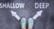 Shallow and deep as different choices in life - pictured as words Shallow, deep on a road to symbolize making decision and picking