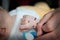 Shallow depth of field of hand of a sick infant patient..