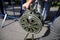 Shallow depth of field image with a man handling a vintage hand crank air raid siren