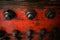 Shallow depth of field image with worn out heavy iron industrial equipment used in the oil and gas drilling industry rusty bolts