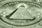 Shallow depth of field picture of the eye of providence on the back of an American single.