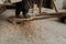 Shallow depth of field selective focus details with a craftsman using an ancient Roman woodturning lathe to make a bowl during a