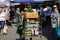 Shallow depth of field selective focus details with a man pushing a cart with vegetables in Obor market in Bucharest, Romania