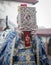 Shallow depth of field selective focus details with a Romanian orthodox christian priest holding a Holy Bible outside a church