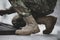 Shallow depth of field selective focus image with the boots and uniform of a Romanian soldier