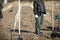 Shallow depth of field selective focus image with a man during a massive tree planting project