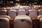 Shallow depth of field selective focus image with numbered chairs inside a theatre/cinema