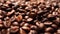 Shallow depth of field shot of Dark Coffee beans,Coffee beans splashed from above