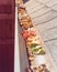 Shallow DOF colorful green, yellow, orange, red autumn leaves clogged house gutter near Dallas