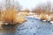 Shallow, fast, unfrozen river in winter. Snow melts spring streams. HDR