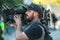 Shallow focus of an Australian news cameraman filming the climate change protest outdoors