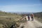 Shallow focus closeup of hikers hiking on the Ambles Valley, Avila, Castile and Leon, Spain