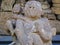 Shallow focus closeup shot of a stone statue of a child hugging an adult