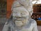 Shallow focus closeup shot of a stone statue of a male face with a beard