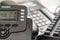 Shallow focus image of a generic VOIP business telephone showing part of its keypad and LCD display.