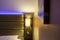 Shallow focus of modern LED ambient mood lighting seen in a modern apartment bedroom.