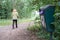 Shallow focus of an overflowing dog waste bin seen in a London park.