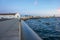 Shallow focus shot of numerous boats by the seacoast at the sunset