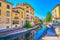 Shallow Lambro river flows in center of Monza town in Lombardy region of Italy