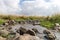 Shallow river flowing near the remnants of the early Bronze Age megalithic complex of the early Bronze Age  Wheels of Spirits,Ruj