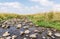 Shallow river flowing near the remnants of the early Bronze Age megalithic complex of the early Bronze Age  Wheels of Spirits,Ruj