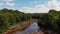 Shallow river with red rocks in the woods. Bonanza falls in Upper Peninsula. Big Iron River in the summer.