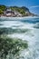 Shallow water with algal plants in front of unique Anse Source D'Argent tropical beach, La Digue Seychelles. Luxury