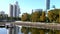 Shallowed city pond in Yekaterinburg. View of the city embankment. Walking in the autumn city