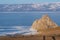 Shaman rock, holy stone of Olkhon island in Baikal frozen lake in winter season, Siberia, Russia