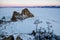 Shamanka rock in winter at sunrise. Olkhon island, Baikal lake, Siberia, Russia.