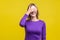 So shameful, i`d rather not watch this! Portrait of bashful positive woman covering eyes with hand.  on yellow background