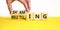 Shaming and belittling symbol. Concept words Shaming and Belittling on wooden cubes. Businessman hand. Beautiful yellow table