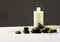 Shampoo bottle, massage stones and iris flower