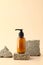 Shampoo dispenser bottle on stone podium. Natural beauty product branding