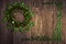 Shamrock wreath, shamrocks on an old rustic wood background.