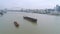 SHANGHAI, CHINA - MAY 7, 2017: Aerial drone view of cargo vessels sailing over the Huangpu river