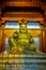 SHANGHAI, CHINA: Religious altar with large golden buddha statue centered above, located inside Jing`an temple district
