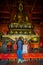 SHANGHAI, CHINA: Religious altar with large golden buddha statue centered above, located inside Jing`an temple district