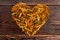 Shape of heart from coloful fusilli pasta.