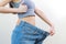 Shape slender, thin waist, attractive slim asian young woman, hand show shape her weight loss, wearing in big, large or oversize