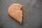Shaped broken heart biscuit on chalkboard background