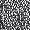 Shapeless modern white drops on a black background. Seamless trendy pattern for fabrics.
