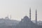 Shapes of the mosques of Sultanahmet or Blue Mosque and Eminonu in the shadow, in Istanbul, with the cupolas and minarets