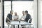 Shaping the company with new ideas. a group of businessmen having a meeting around a table in an office.