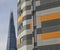 The Shard of London, blue skies and stripy building.